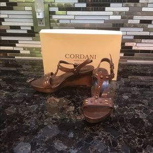 Leather studded wedge sandal.